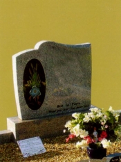 Grey Granite SM018 with black panel inset inscribed with floral 
